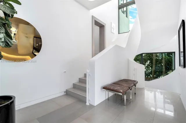 a view of a lake with couches in the patio