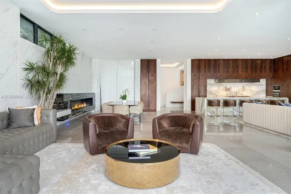 a kitchen with granite countertop a table chairs stove and cabinets