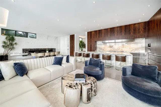 a kitchen with granite countertop a dining table and chairs