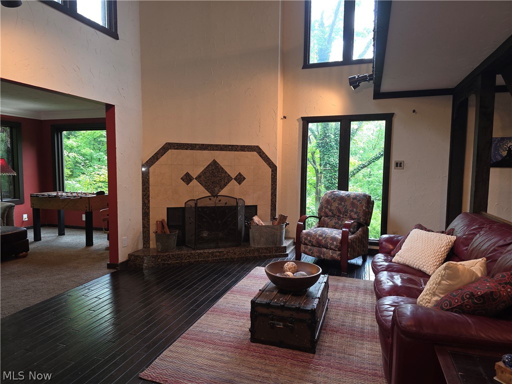 2868 Shade Road Akron, OH 44333 - Photo 26 of 49 Living area featuring dark wood-finish flooring and a tiled fireplace
