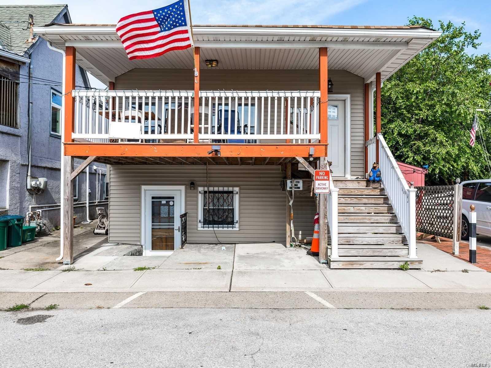 98 Rochester Avenue East Atlantic Beach, NY 11561 - Photo 1 of 1 a view of a house with entrance and a porch