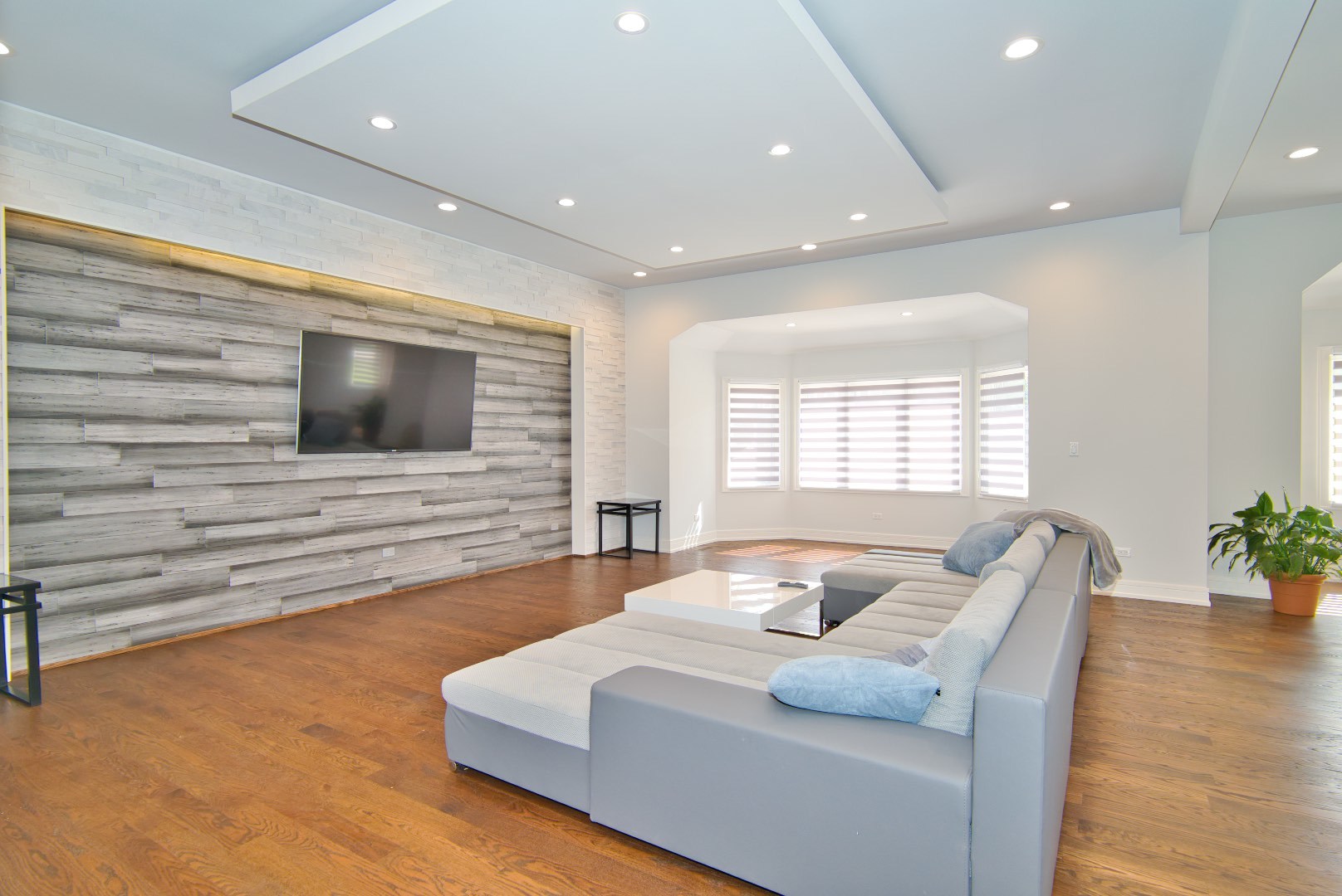 210 Cottonwood Road Northbrook, IL 60062 - Photo 12 of 47 a living room with furniture and a flat screen tv
