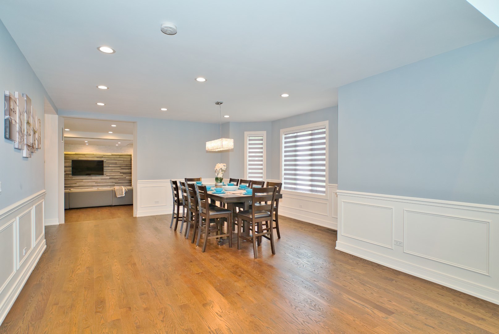 210 Cottonwood Road Northbrook, IL 60062 - Photo 18 of 47 a kitchen with stainless steel appliances granite countertop a stove a sink a dining table and chairs with wooden floor