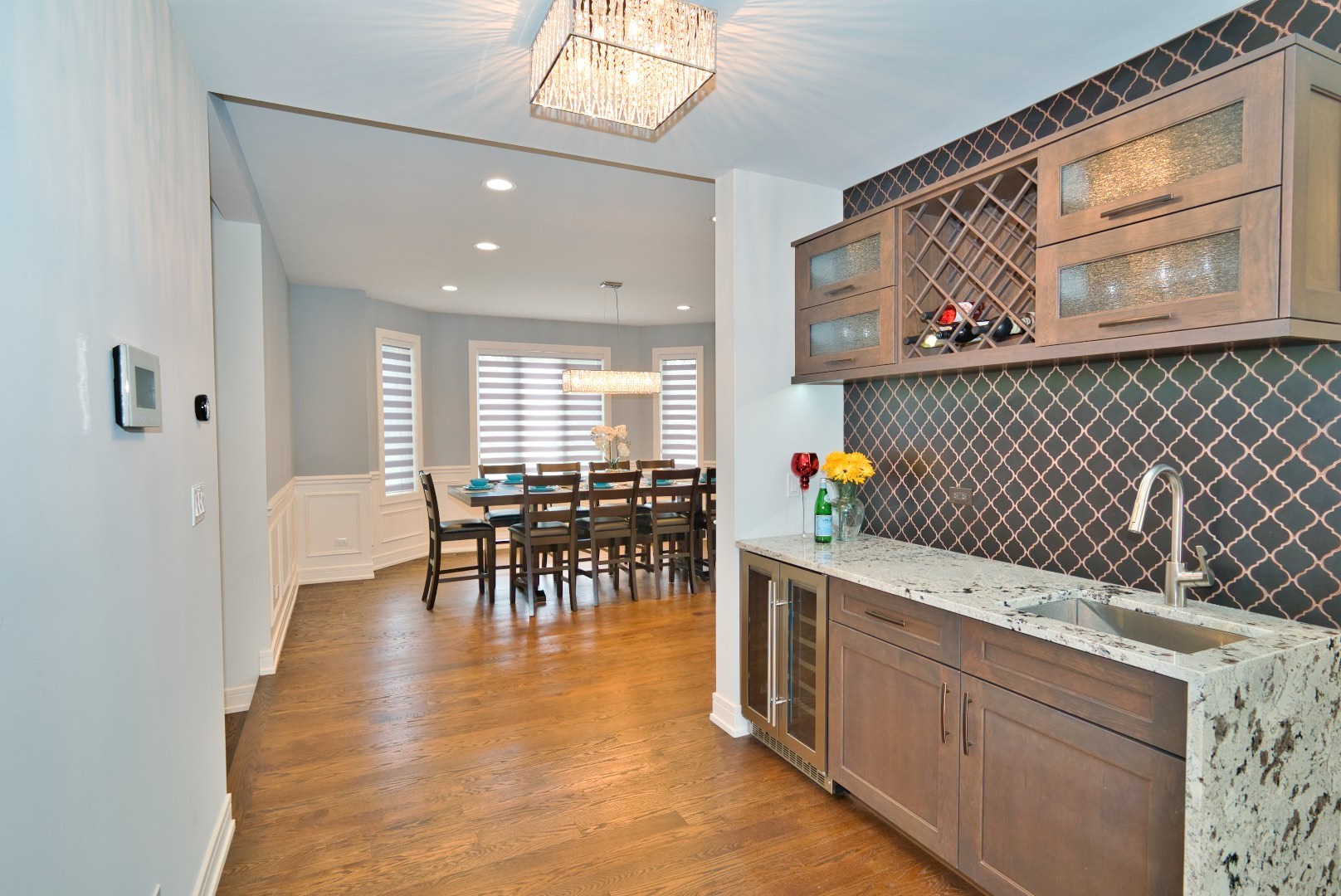 210 Cottonwood Road Northbrook, IL 60062 - Photo 20 of 47 a kitchen with stainless steel appliances granite countertop sink a table and chairs