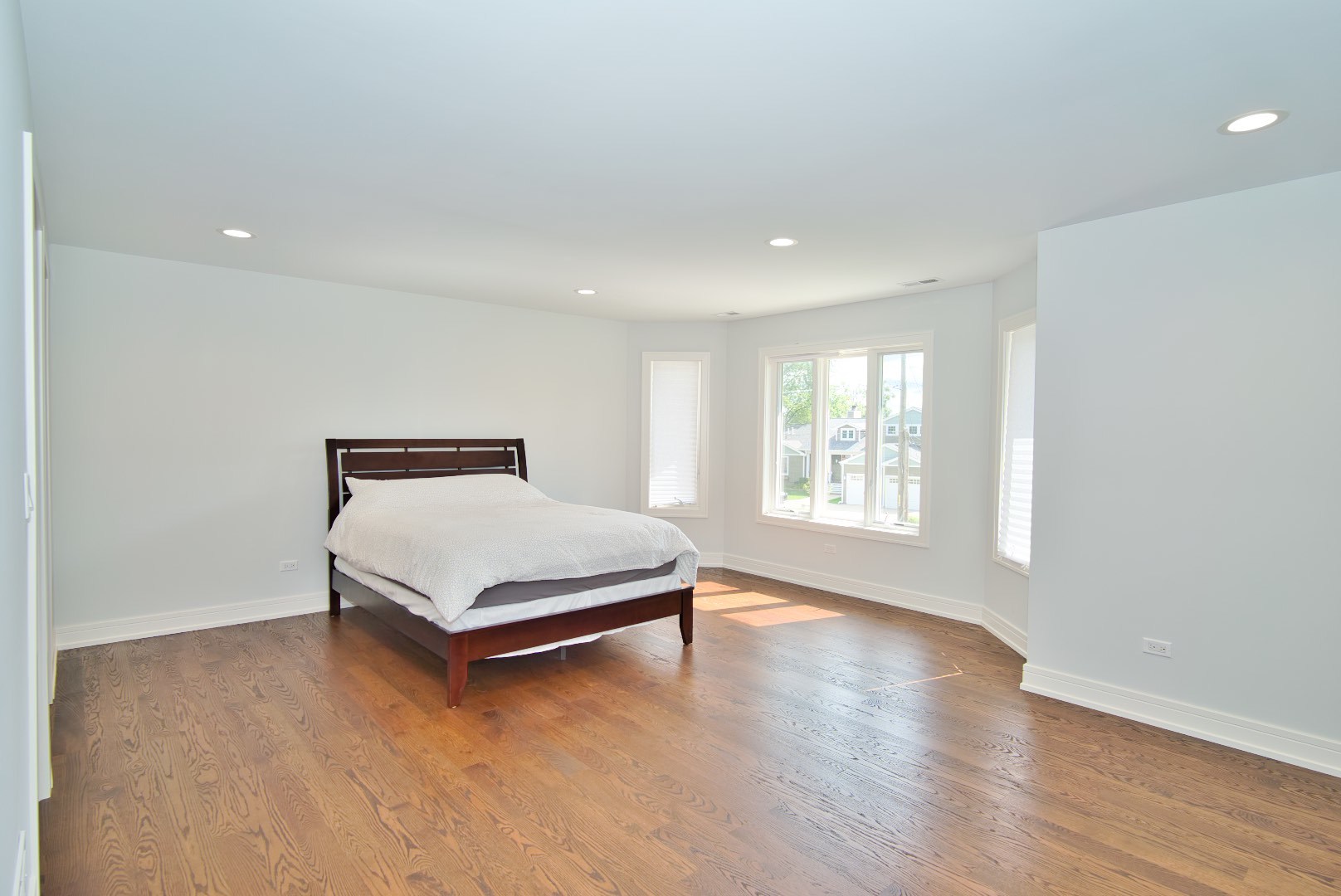 210 Cottonwood Road Northbrook, IL 60062 - Photo 36 of 47 a bed sitting in a spacious bedroom next to a window