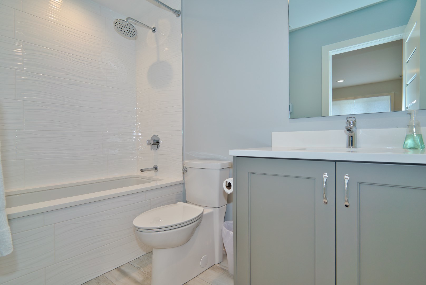 210 Cottonwood Road Northbrook, IL 60062 - Photo 40 of 47 a bathroom with a granite countertop toilet a sink and bathtub