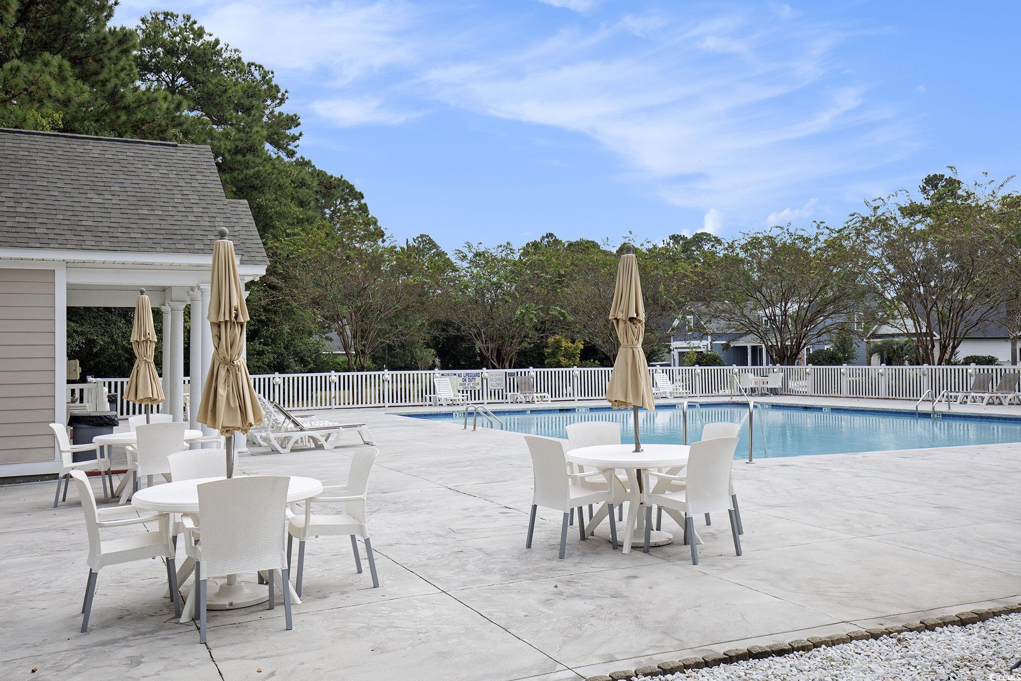 4036 Girvan Drive Myrtle Beach, SC 29579 - Photo 24 of 38 Community pool featuring a patio