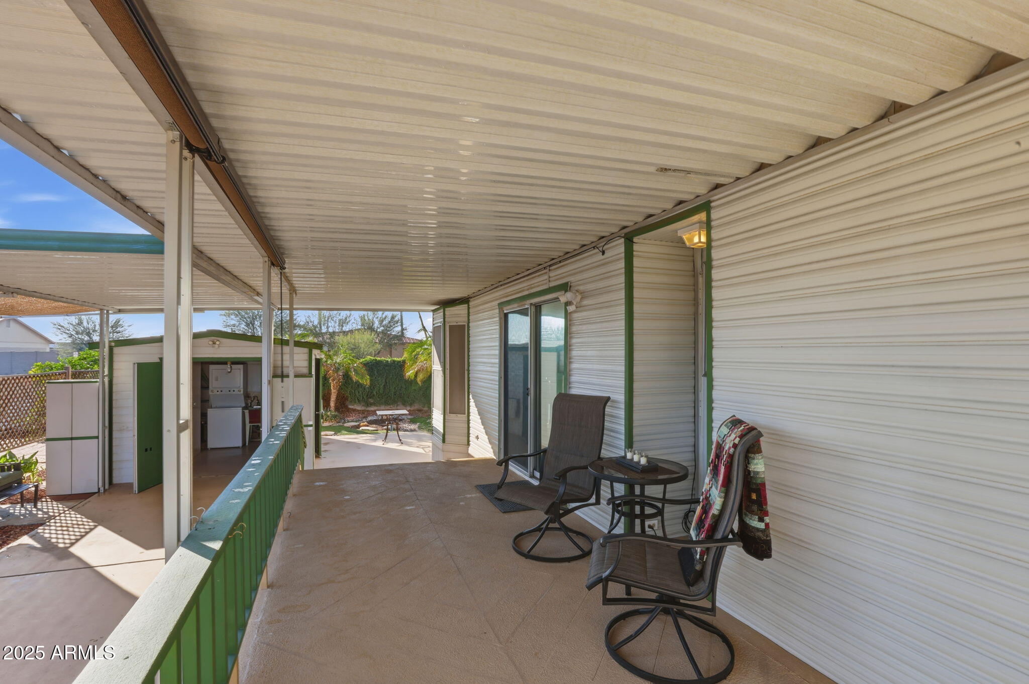 11201 North El Mirage Road, Unit 720 El Mirage, AZ 85335 - Photo 12 of 43 a view of a patio with chairs and table in patio