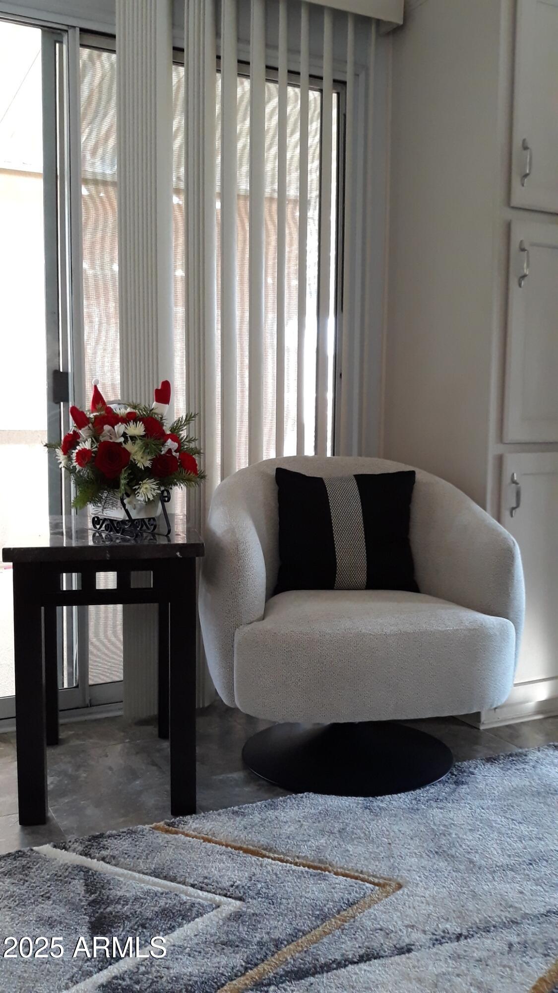 11201 North El Mirage Road, Unit 720 El Mirage, AZ 85335 - Photo 18 of 43 a living room with furniture and large windows