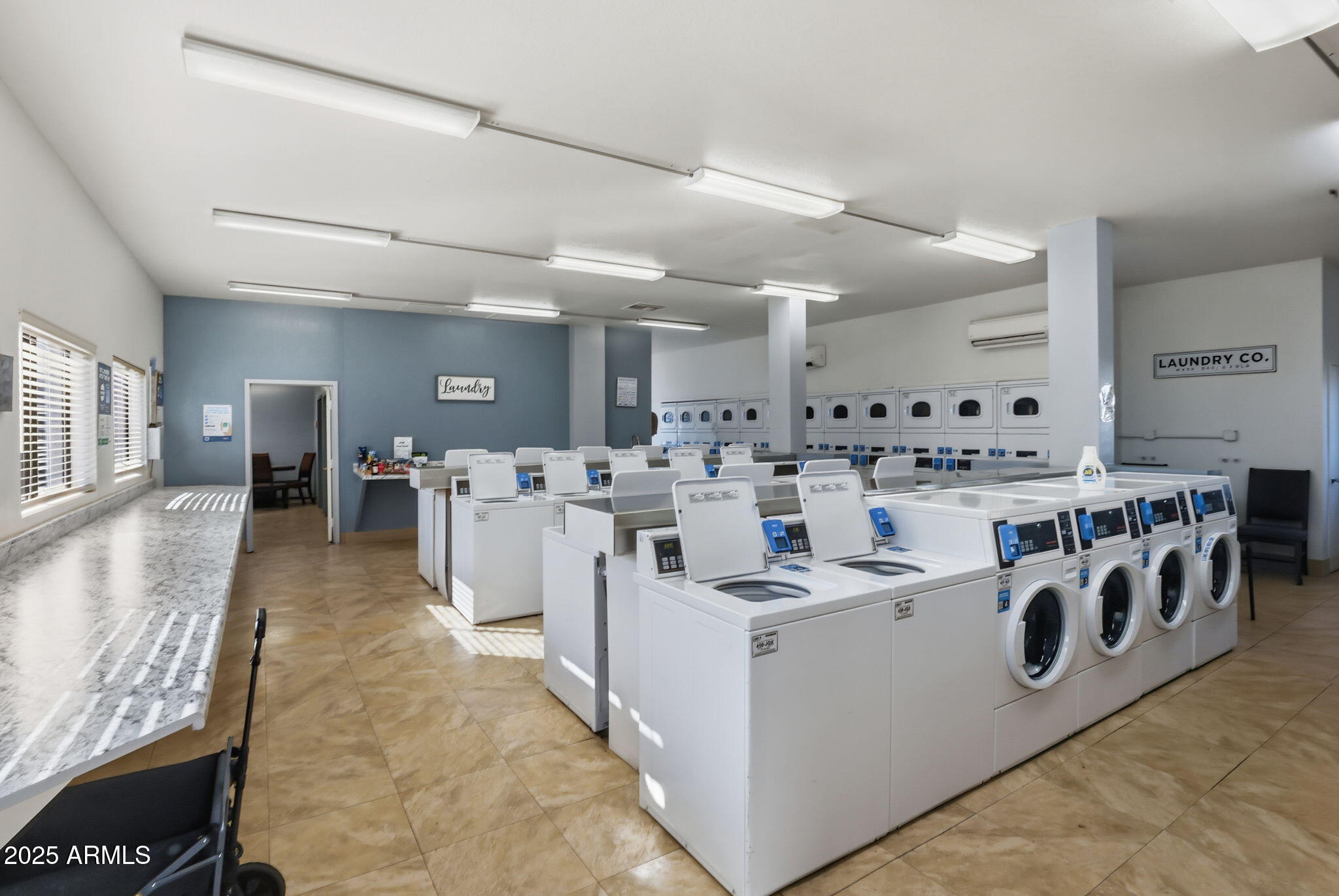 11201 North El Mirage Road, Unit 720 El Mirage, AZ 85335 - Photo 43 of 43 a large white kitchen with lots of counter top space