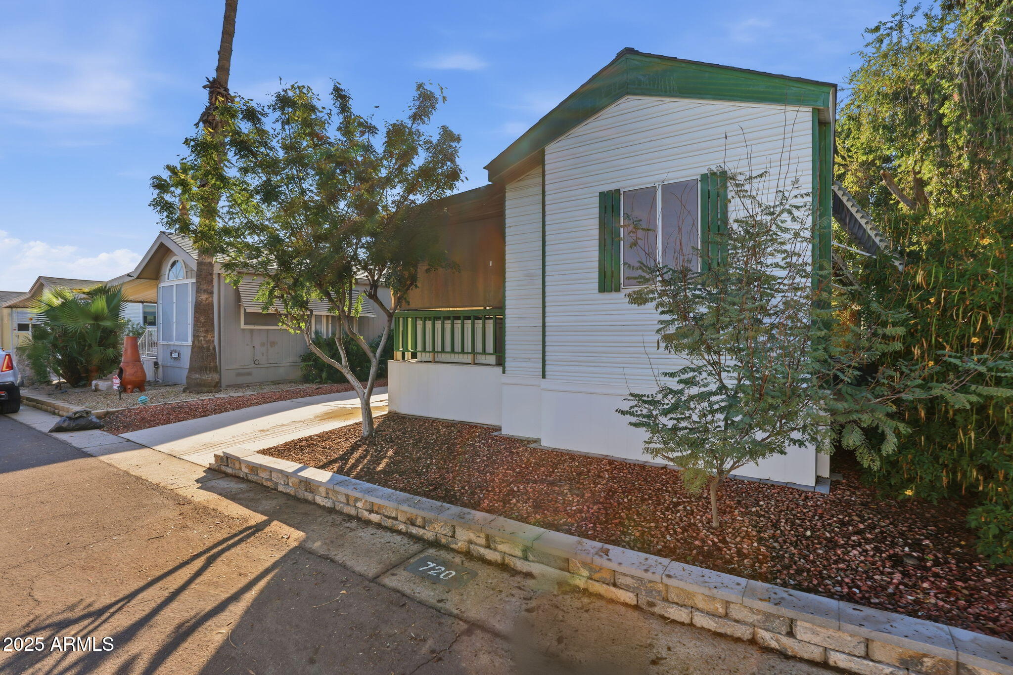 11201 North El Mirage Road, Unit 720 El Mirage, AZ 85335 - Photo 5 of 43 a front view of a house with garden