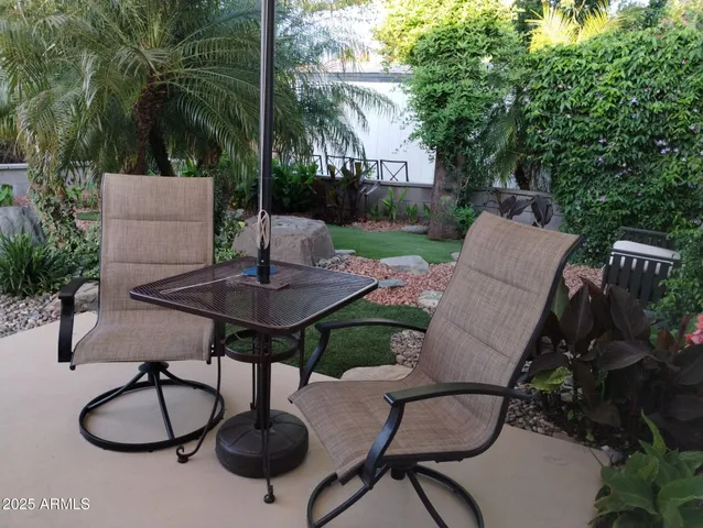 a kitchen with a white cabinets and window