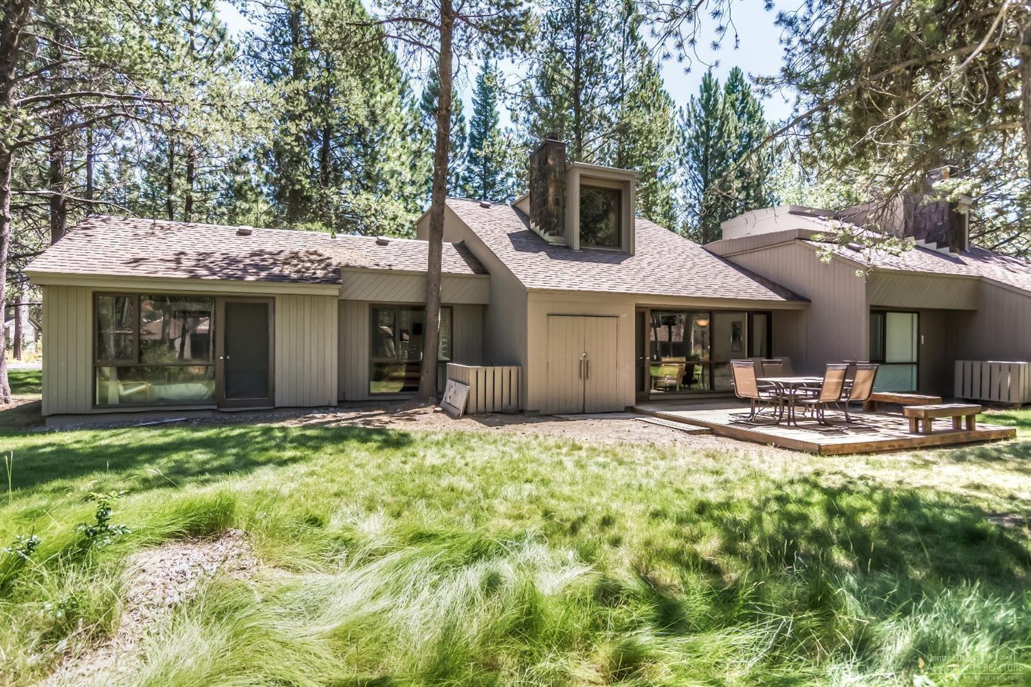 57206 Island Road Sunriver, OR 97707 - Photo 4 of 20 a front view of a house with garden