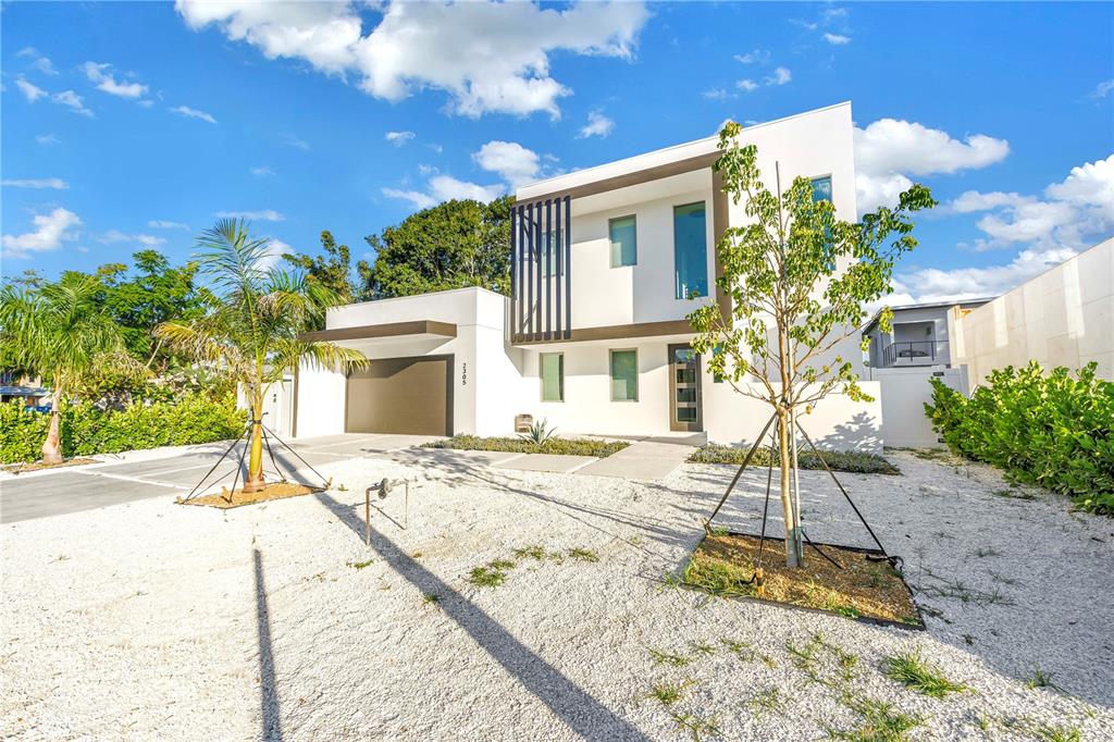 2305 Temple Street Sarasota, FL 34239 - Photo 2 of 64 a house view with a outdoor space