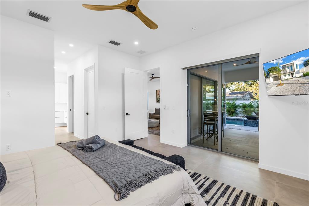 2305 Temple Street Sarasota, FL 34239 - Photo 21 of 64 a bedroom with a bed and a walk in closet