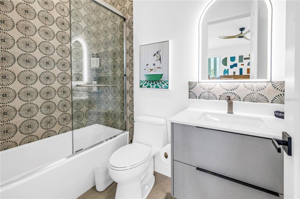 2305 Temple Street Sarasota, FL 34239 - Photo 47 of 64 a bathroom with a sink toilet and shower