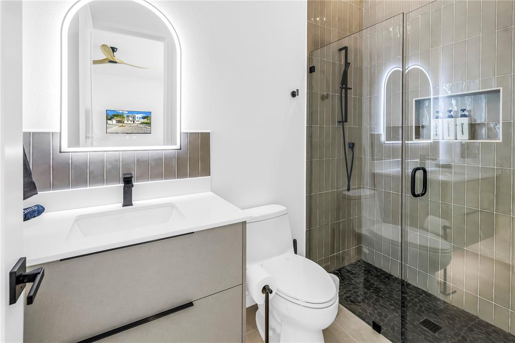 2305 Temple Street Sarasota, FL 34239 - Photo 50 of 64 a bathroom with a sink toilet and shower