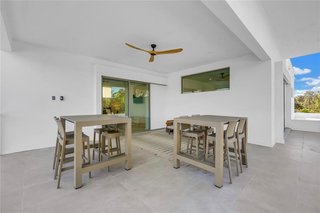 2305 Temple Street Sarasota, FL 34239 - Photo 52 of 64 a view of a dining room with furniture and a window