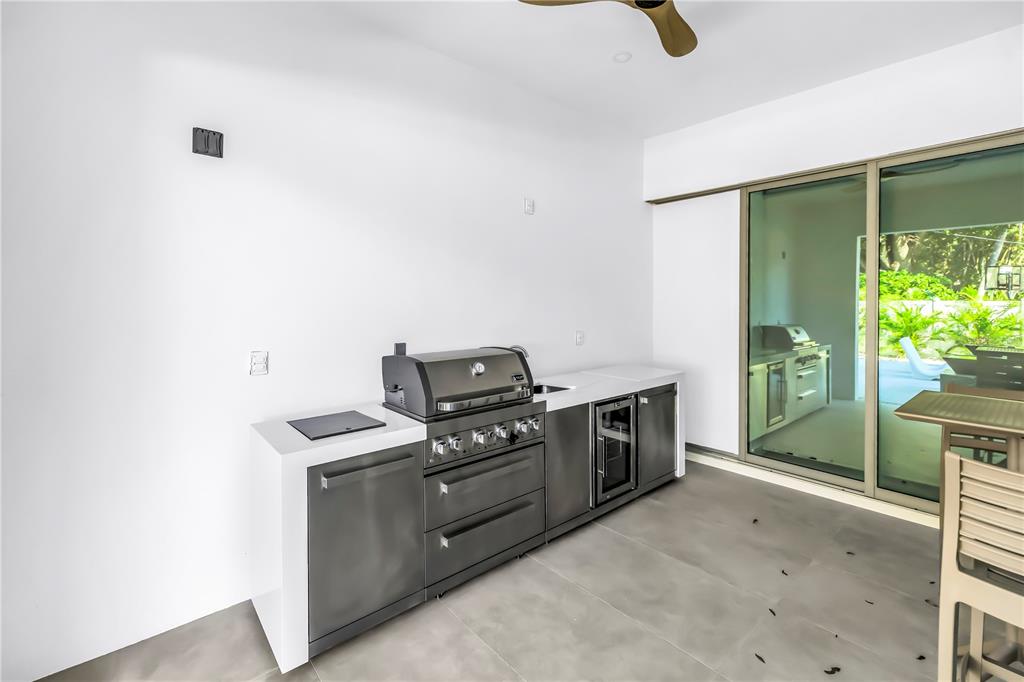 2305 Temple Street Sarasota, FL 34239 - Photo 59 of 64 a kitchen with a stove and a shower