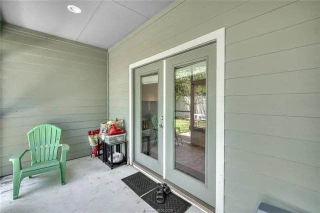 a front view of a house with a garden and plants