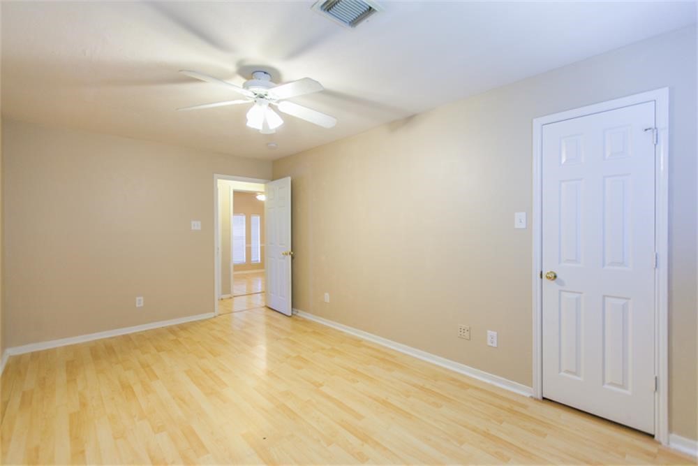 13630 Country Green Court Houston, TX 77059 - Photo 21 of 30 a view of an empty room and chandelier fan