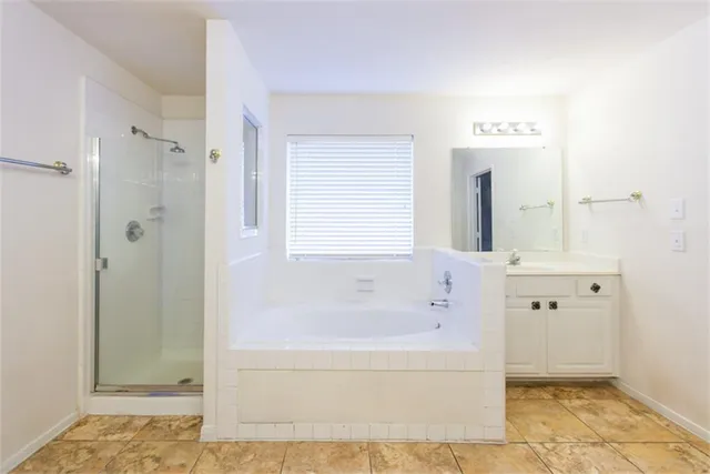 a bathroom with a bathtub and shower