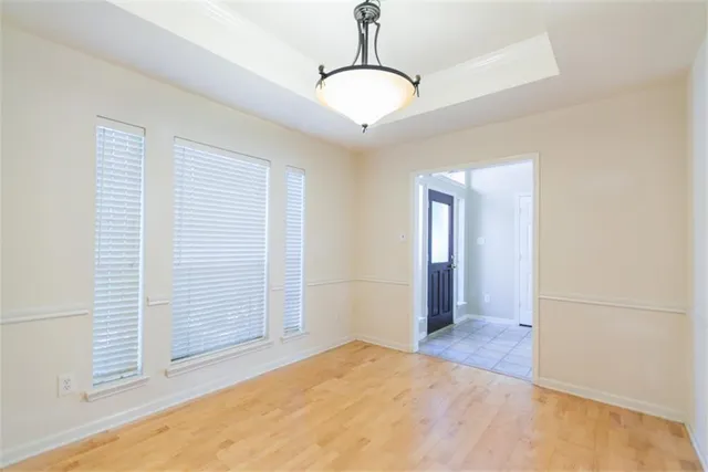 a view of a room with cabinet and mirrors