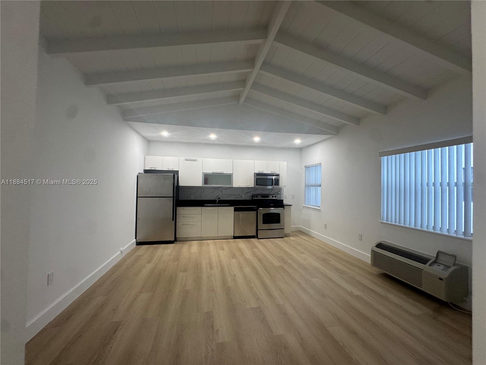a view of a livingroom with furniture