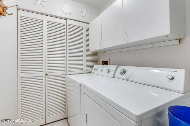 a utility room with dryer and washer