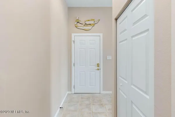 a view of an entryway with wooden floor