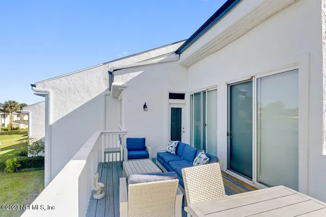 a view of balcony with furniture