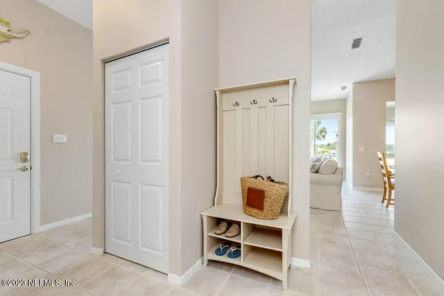 a view of living room with furniture and wooden floor