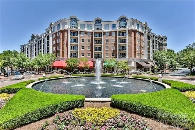 a view of house with swimming pool and yard