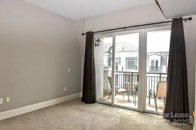a view of a balcony with wooden floor and windows
