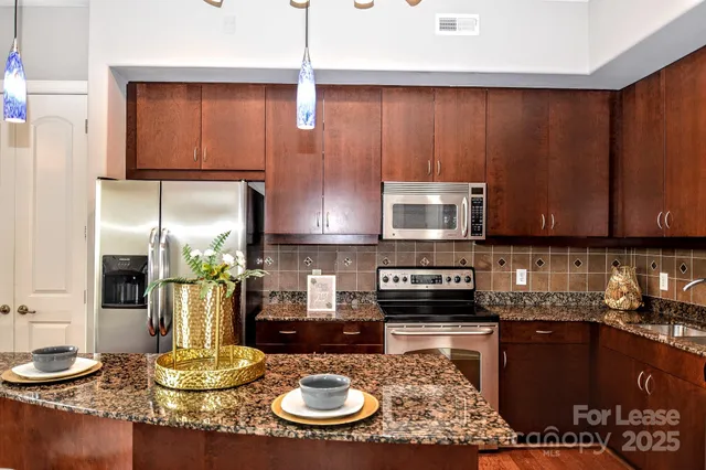 a view of a dining room and kitchen