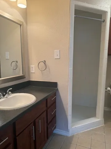 an empty room with a empty space and windows