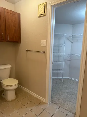 a bathroom with a granite countertop sink a mirror and shower