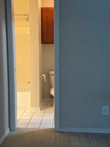 an empty room with a empty space and windows