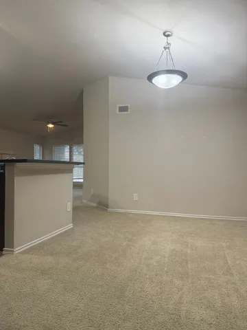 a view of an empty room with a sink