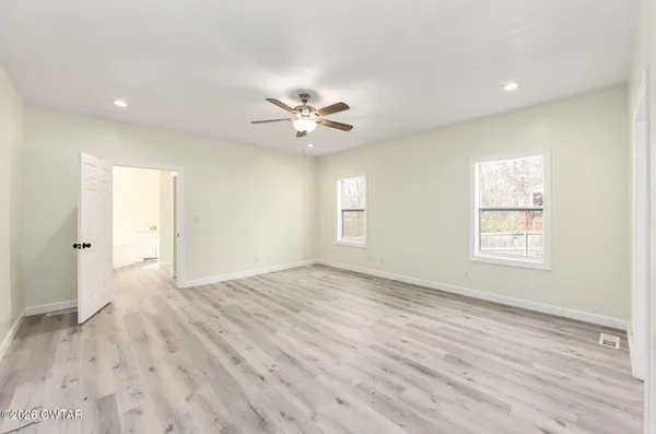 a view of an empty room with a window