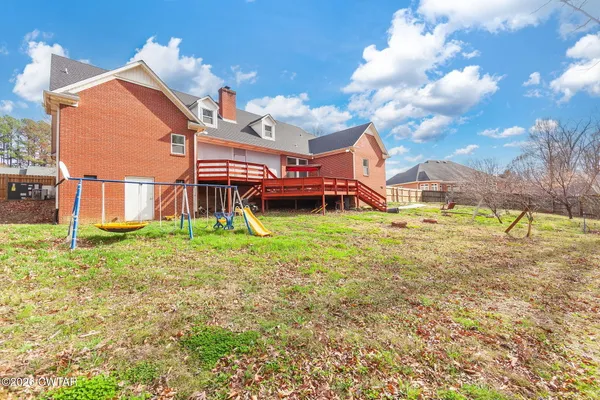 a view of a house with a yard porch and sitting area