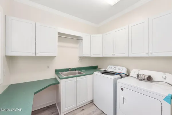 a view of cabinets with washer and dryer