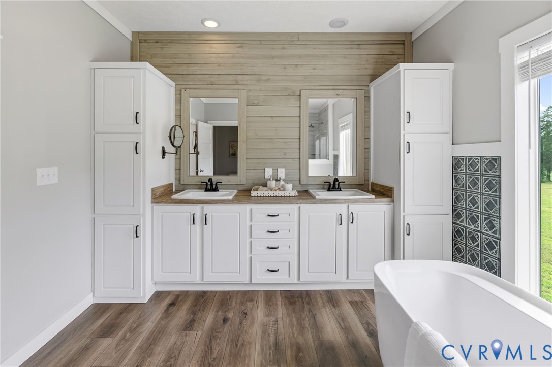 13110 Continental Road Wilsons, VA 23894 - Photo 24 of 35 Dual vanity with white shaker-style cabinetry, woo