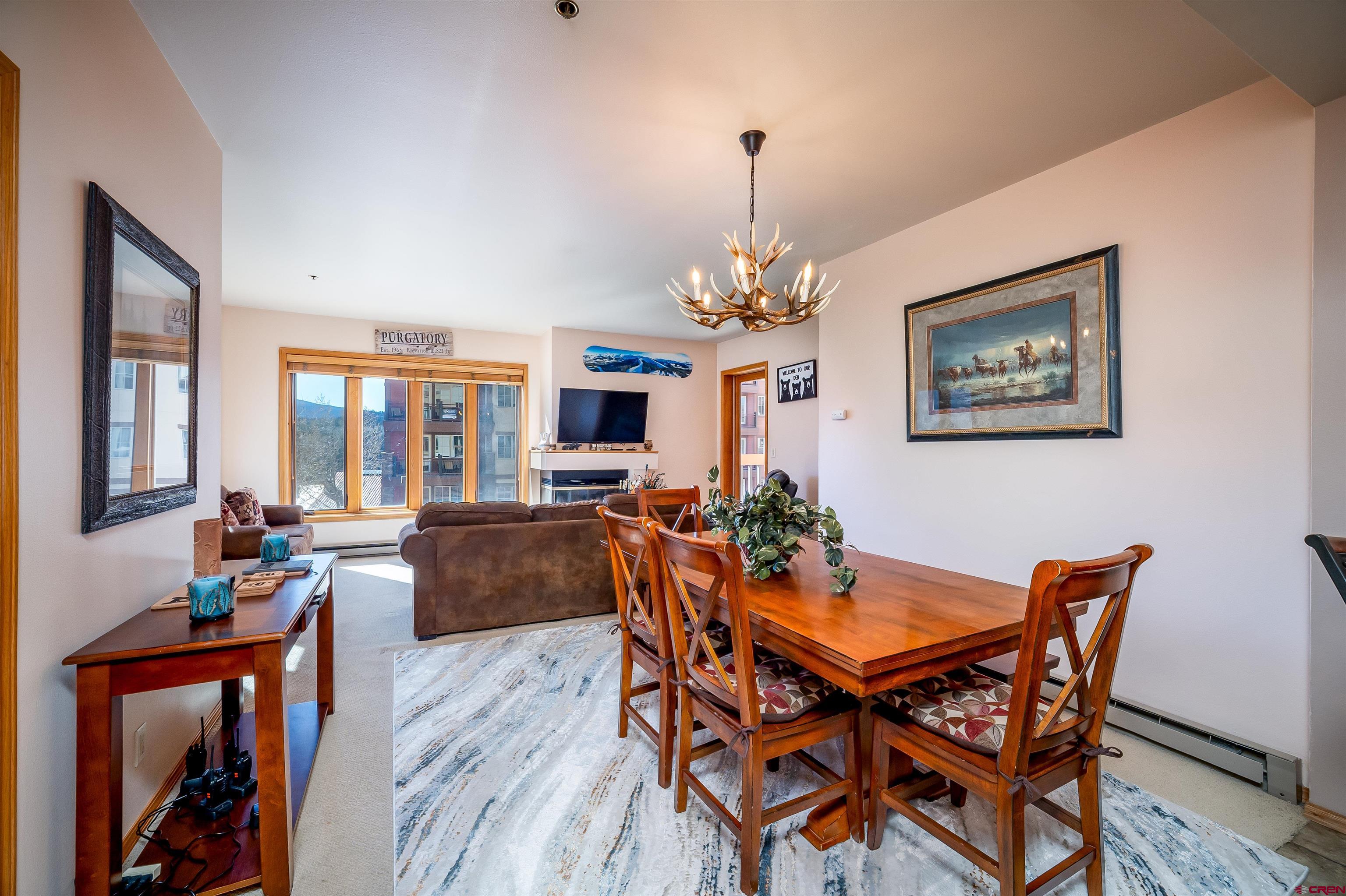 71 East Needles Road, Unit 337 Durango, CO 81301 - Photo 4 of 45 a view of a dining room with furniture window and wooden floor
