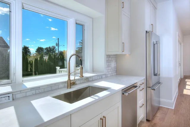 a kitchen with a sink and cabinets