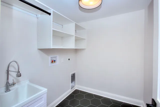 a bathroom with a sink and a window