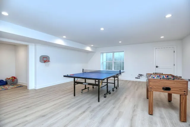 a view of a room with furniture and wooden floor