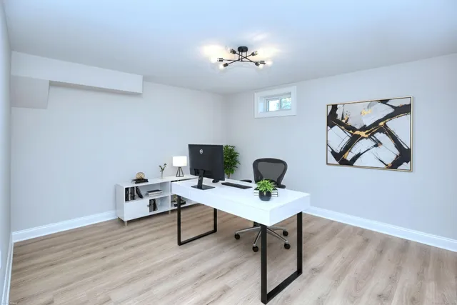 a workspace with furniture and wooden floor