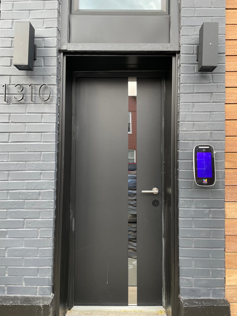 1310 West Erie Street, Unit 2 Chicago, IL 60642 - Photo 2 of 12 a bathroom with a sink and a shower