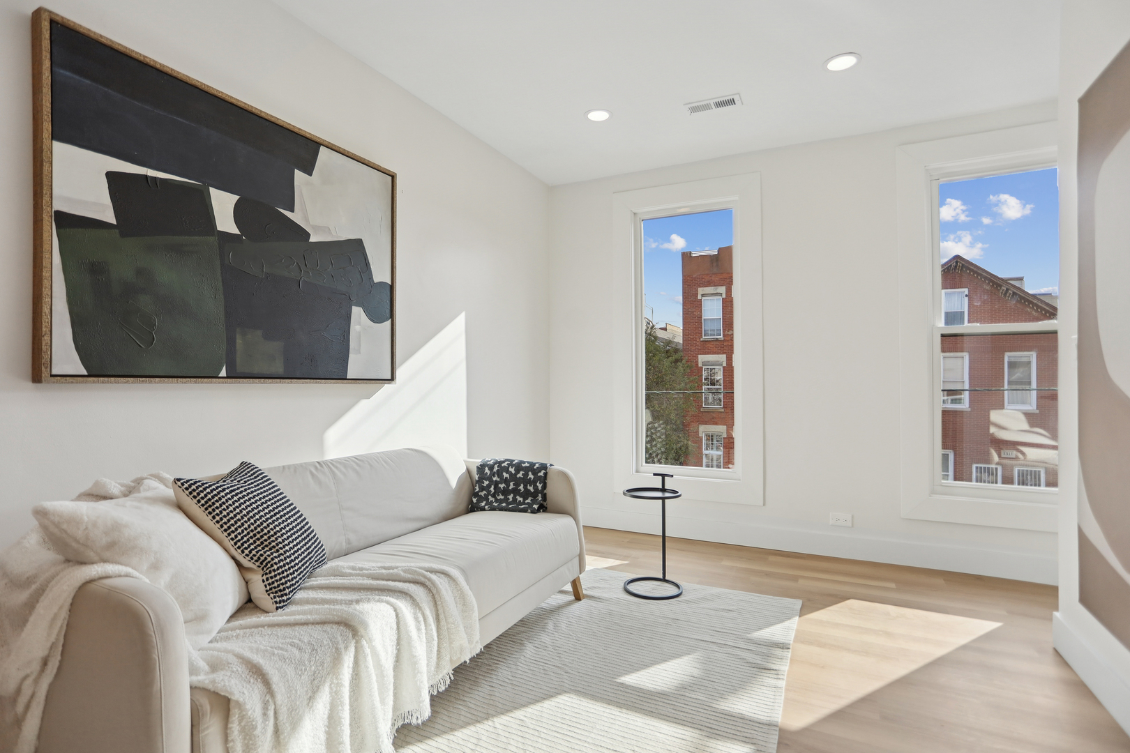 1310 West Erie Street, Unit 2 Chicago, IL 60642 - Photo 3 of 12 a living room with furniture and a window